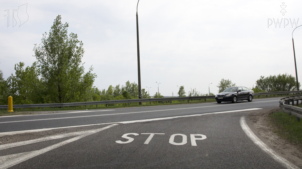 Does the word "STOP" on the roadway confirm the marking of the entry to the junction with a vertical "stop" sign?