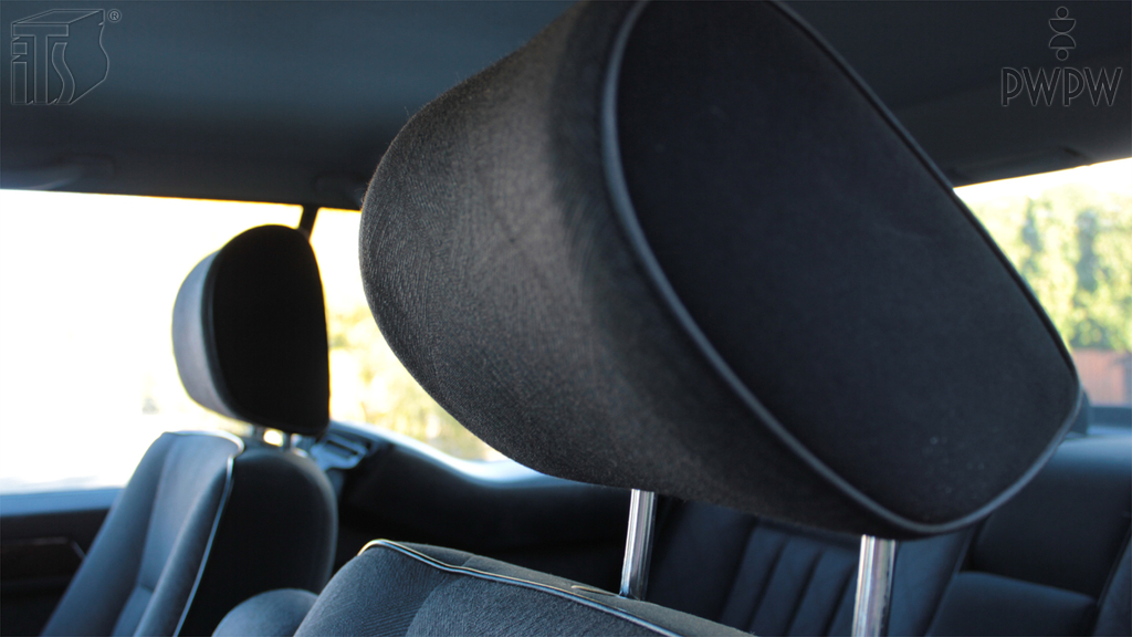 How should the headrest be positioned?