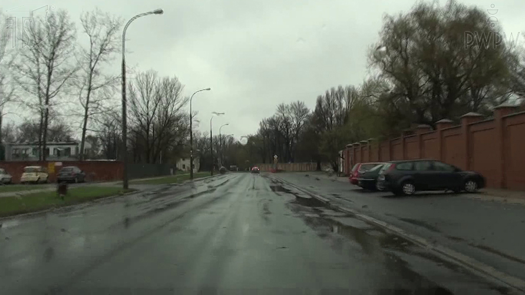 How should you react if you enter a section of the road covered with puddles?