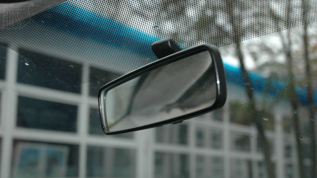What should you see in a properly-positioned rear-view mirror?