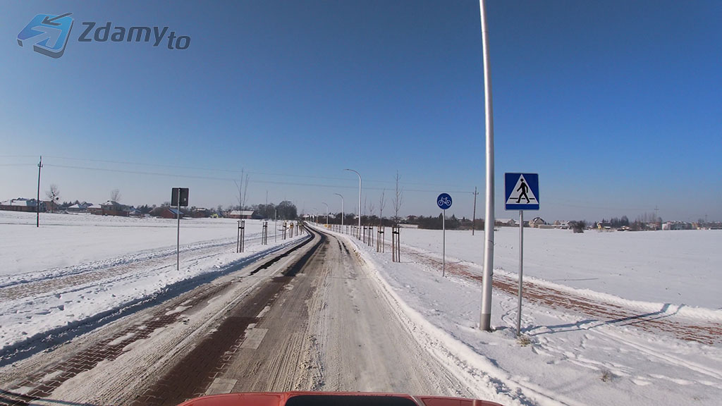 In the presented situation, are you allowed to continue driving through the pedestrian crossing without stopping?