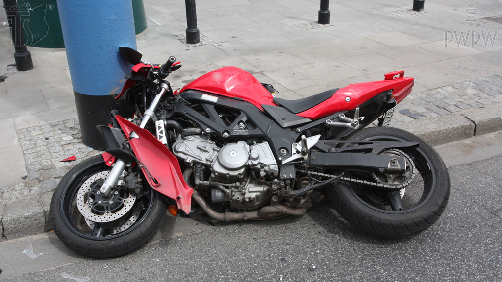 Which of the following outfits offer the most effective protection in the event a motorcycle falls over?