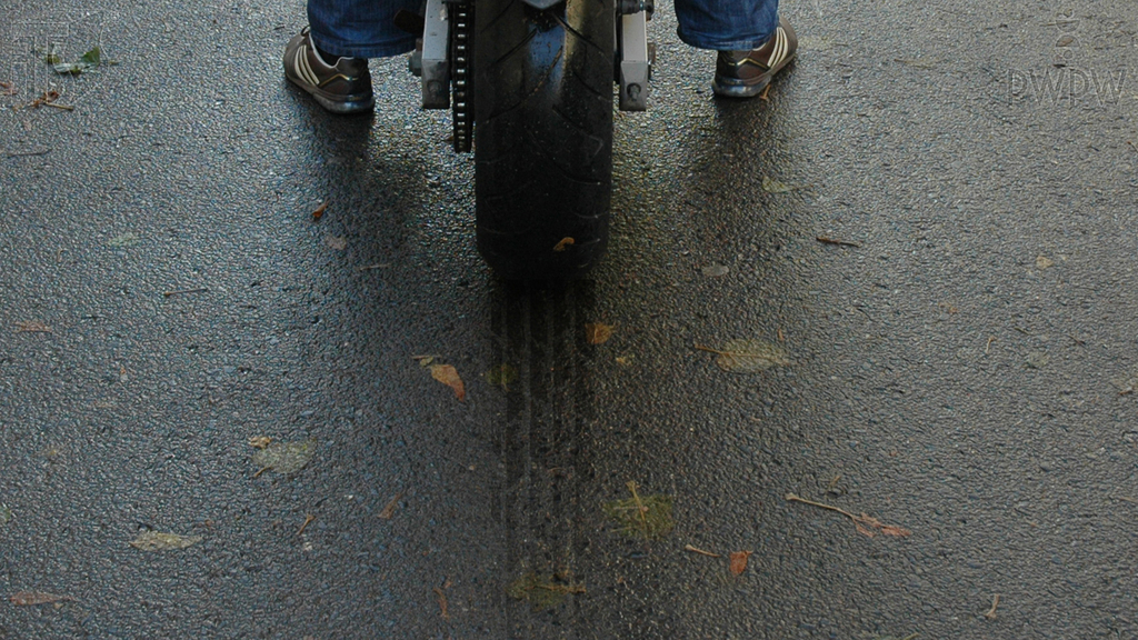 What is the main factor determining the braking distance of a motorcycle?