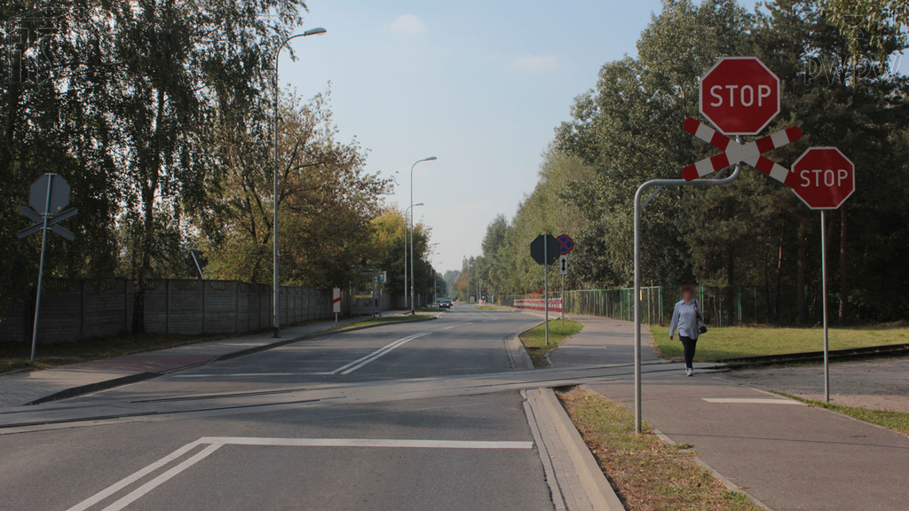 If you approach a railway crossing on a motorcycle, how will you make sure that a train is not approaching?