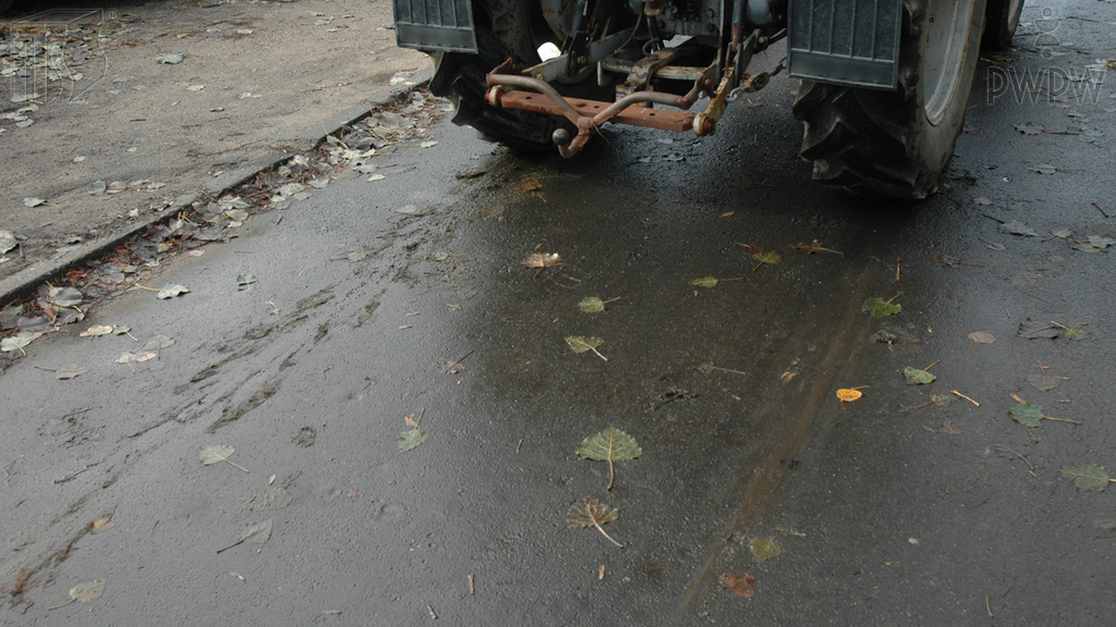 What is the main factor determining the emergency braking distance of a tractor?