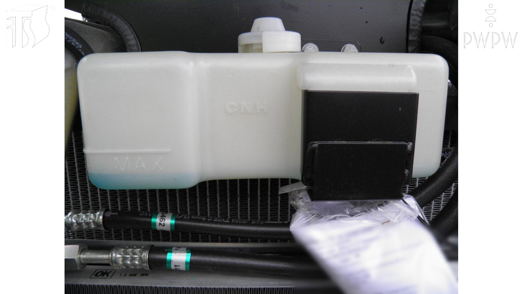 What should you do if the engine coolant of a tractor is not visible in the reservoir?