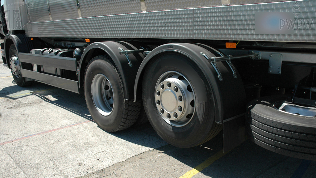 By approximately how much does the braking distance of a truck increase if the speed doubles?