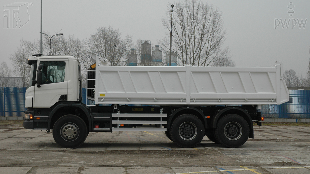 How should a load be placed in a truck?