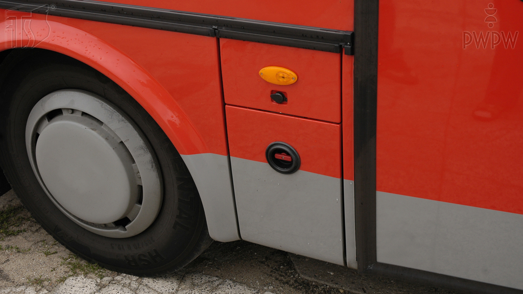 What necessary activities should be performed by a bus driver while replacing a wheel?