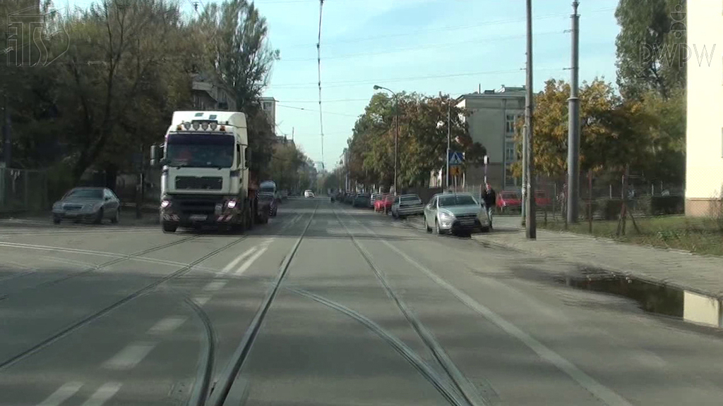In this situation, turning left to the depot, do you have priority over the vehicle coming in the opposite direction?