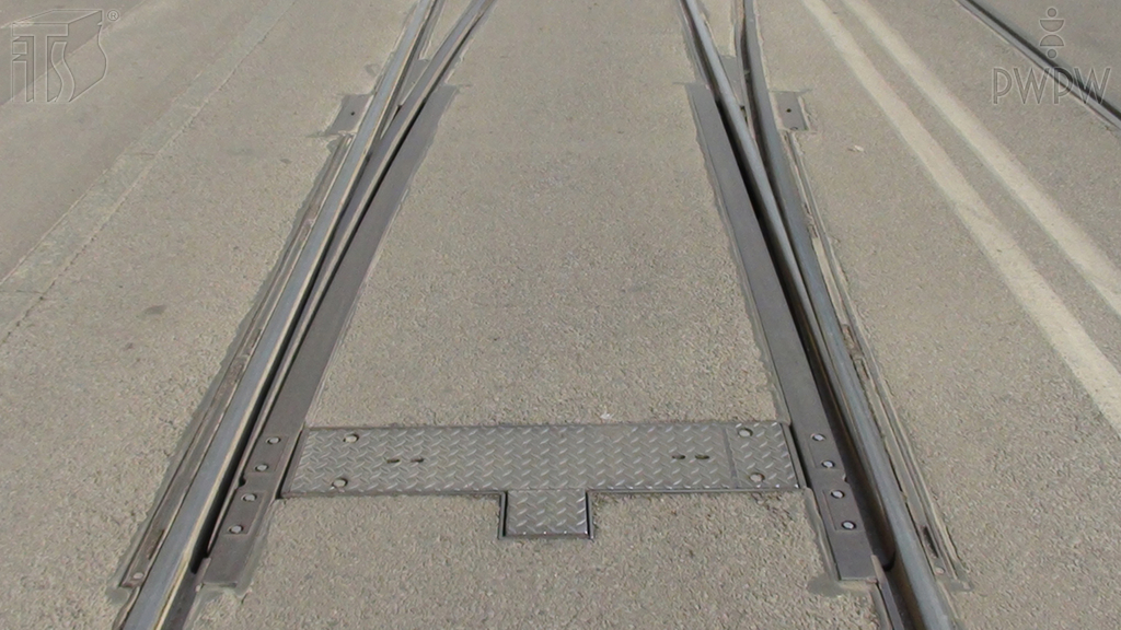 Are you allowed to stop a two-coach tram on the rail switch while reversing?