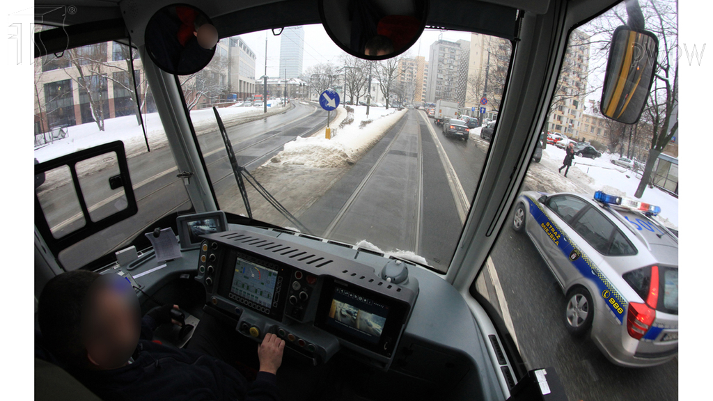 In this situation, in a built-up area, are you allowed to overtake the municipal police vehicle flashing blue signal lights and sound signal with a changing tone?