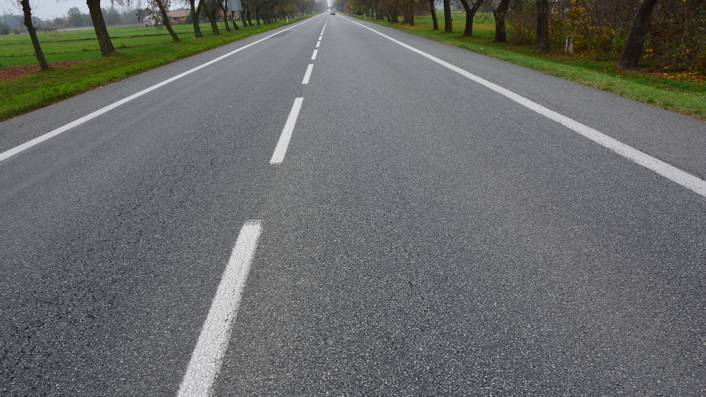 Is the visible line separating traffic lanes where the lines are longer than the gaps a broken line?