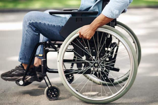 When turning into a crossroad, are you obliged to give way to a person in a wheelchair crossing the road at the junction you are entering?