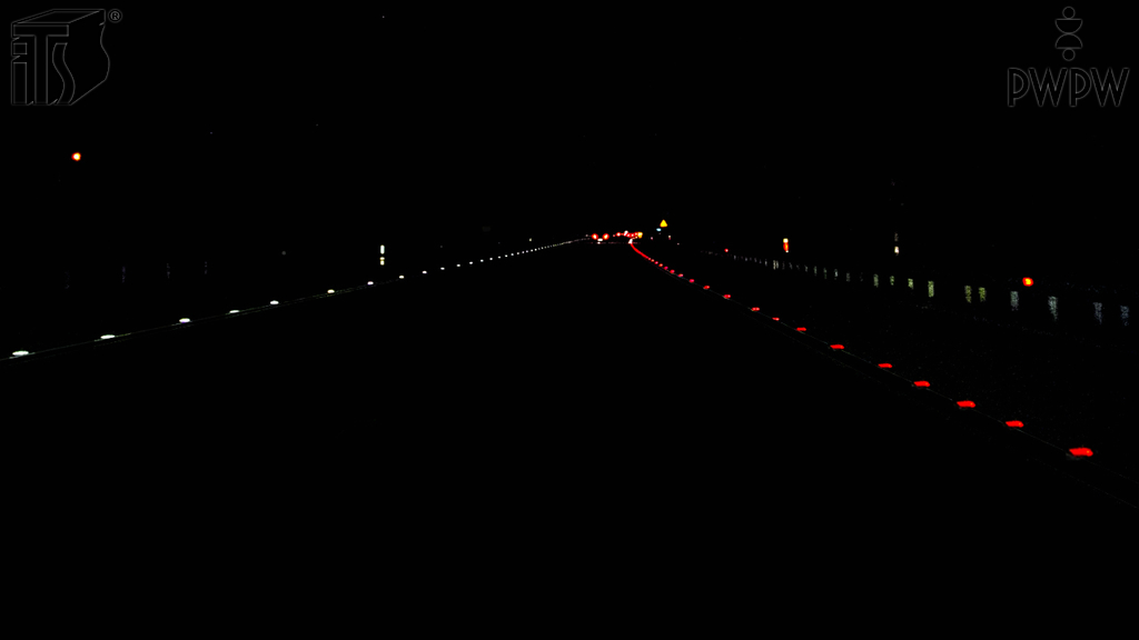 Does this line composed of white reflective road studs mark the left edge of the roadway?