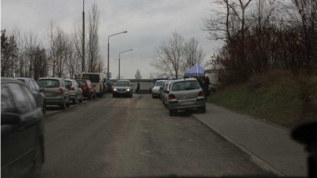 In the visible situation, can you continue driving in front of the vehicle approaching from the opposite direction?