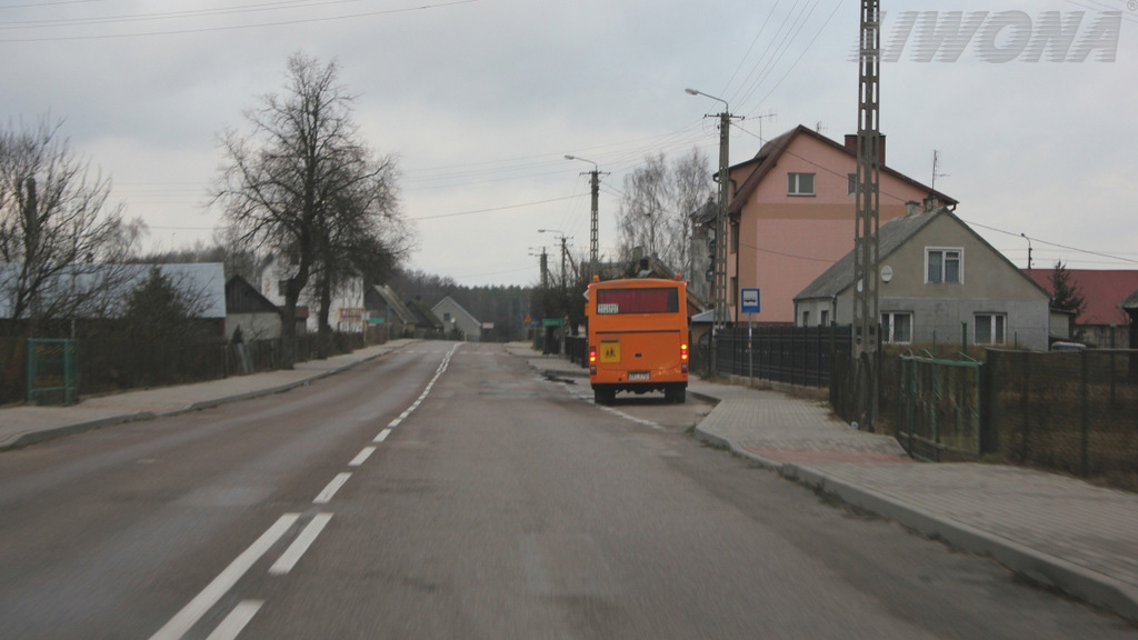 When approaching the stopping place for a school bus outside the built-up area, are you obliged to allow the driver of the bus to enter the roadway, if it signals the intention to perform such a manoeuvre?