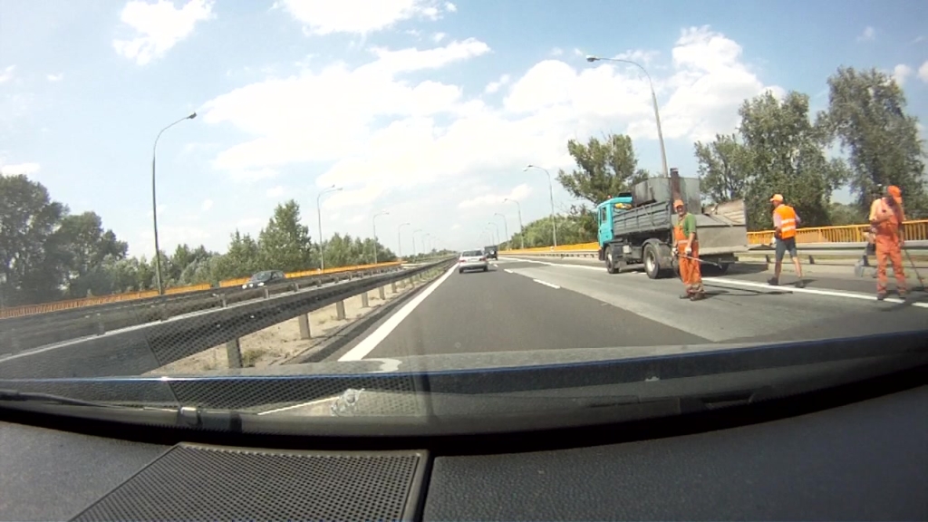 Can the person performing roadworks on a road on behalf of or with the consent of the road administration give commands or signals to road users?